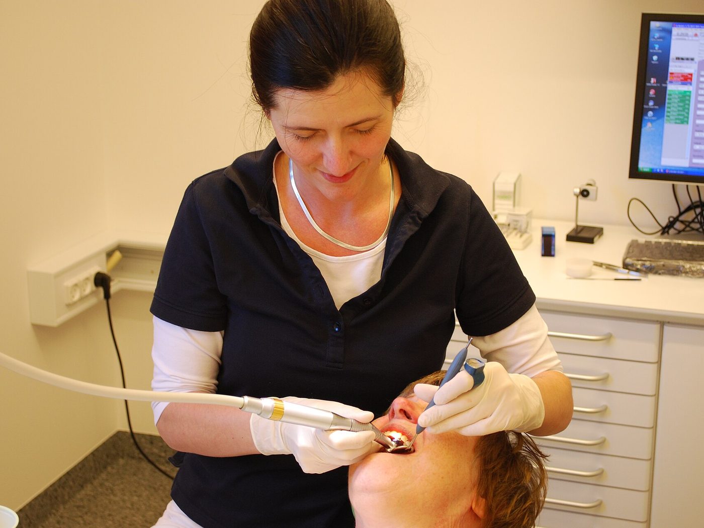 Dental professional providing patient care